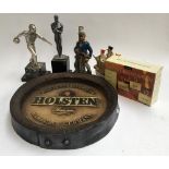 A Holsten, Germany beer advertising plaque in the form a barrel end; together with several