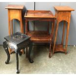 A pair of arts and crafts style light mahogany pot stands, 80cmH; together with an ebonised