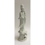 A Chinese blanc de chine figure of Guanyin the Boddhisatva of Compassion, 32.5cmH