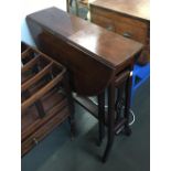A small oval drop-leaf table, crossbanded, 60cmW