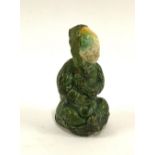 Japanese sansai figurine of a sitting figure holding a rabbit, c.1800, 7.5cmH
