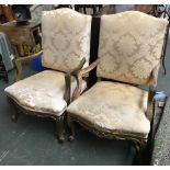 A pair of French large open armchairs, with acanthus carved arms, with carved serpentine apron and
