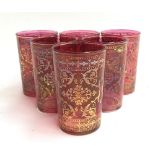 A set of six Austrian cranberry glass tumblers, with scrolling gilt decoration, approx. 10cmH