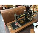 A Pfaff German sewing machine, in domed oak carry case