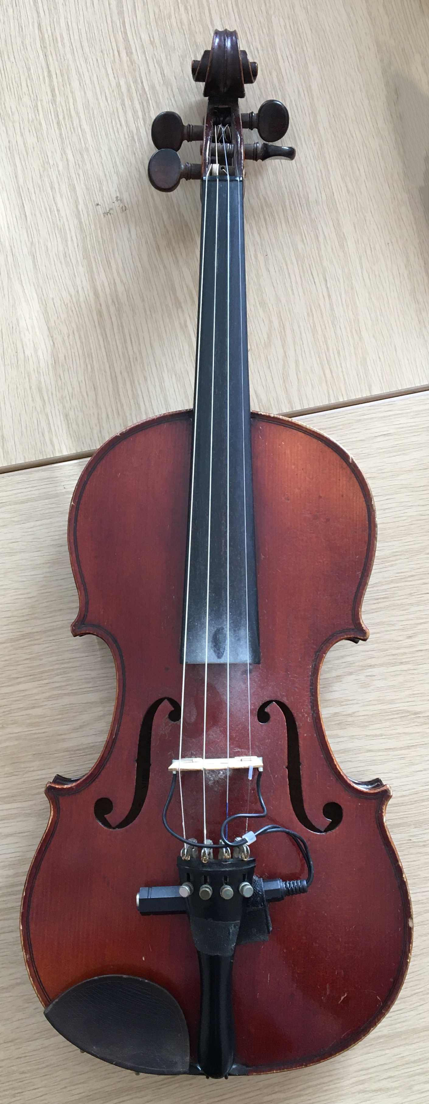 A c.1900 violin, bears label for Mansuy a Paris, one piece 14" back, in hard case with two bows, one