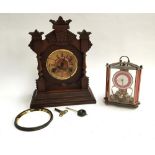 A carved American mantel clock (af), with key and pendulum, marked Ansonia Clock Co. New York;