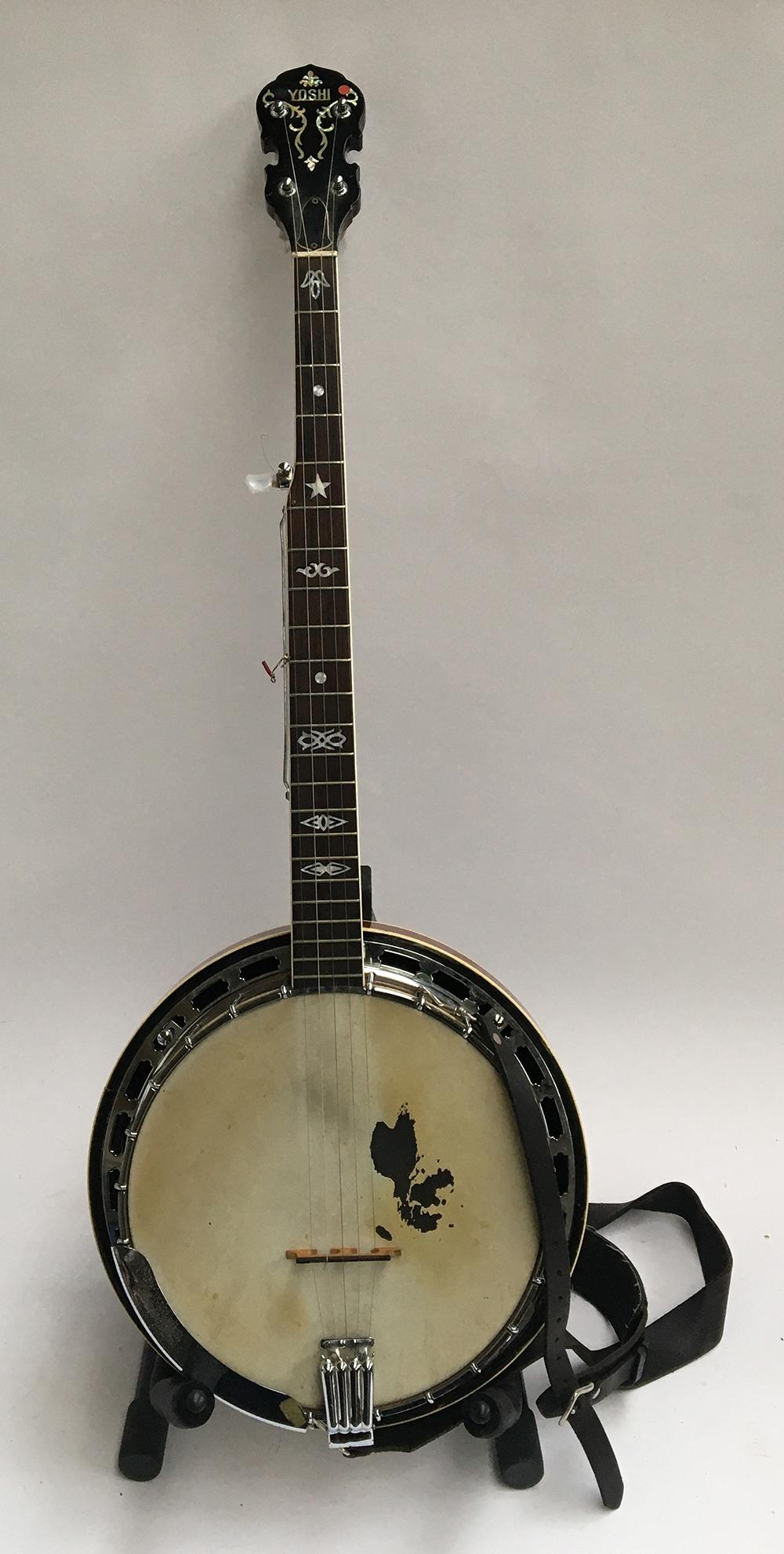 A Japanese five string Yoshi banjo, in soft case