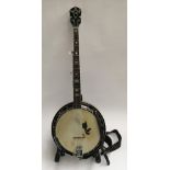 A Japanese five string Yoshi banjo, in soft case