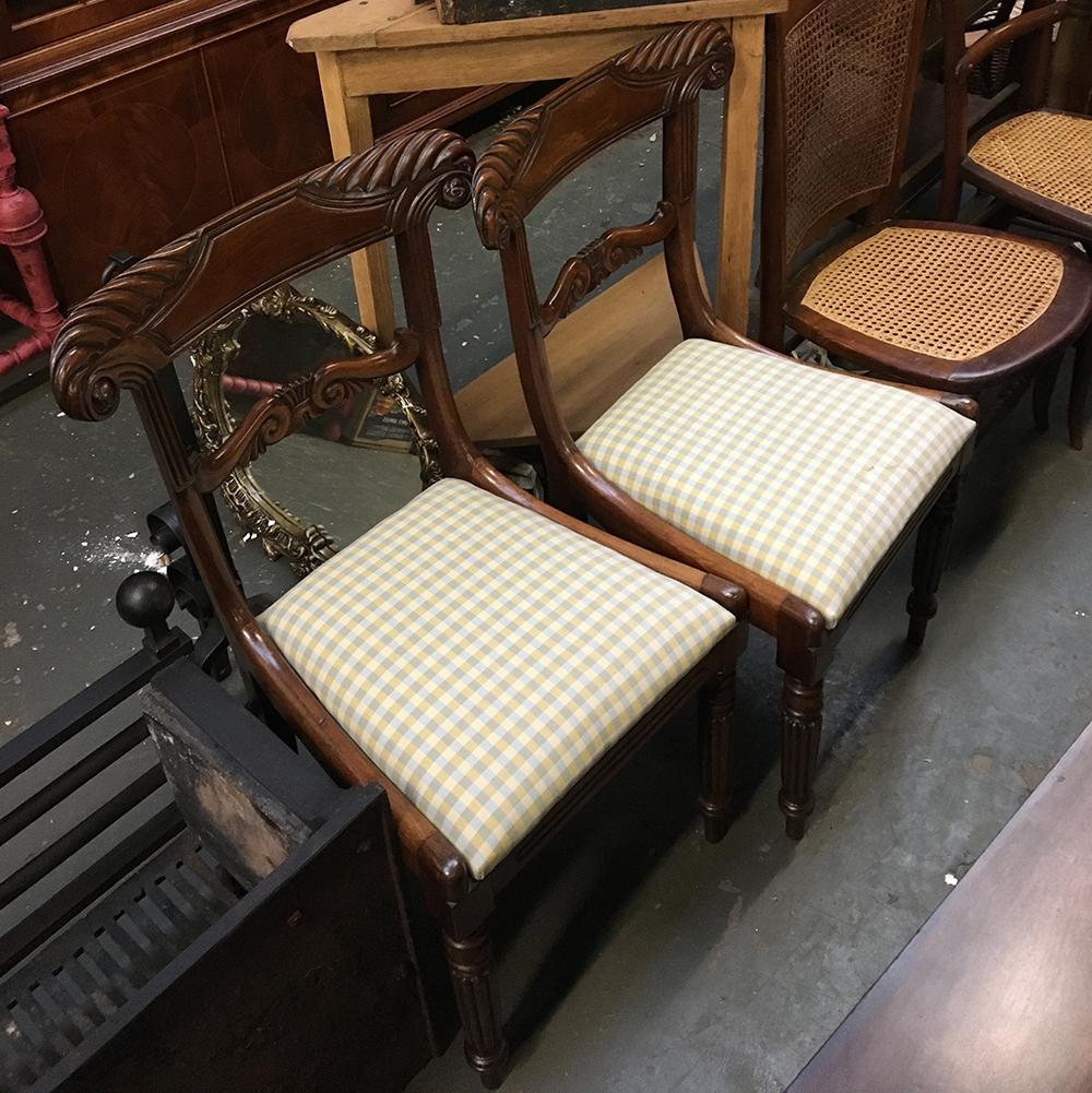A pair of 19th century carved occasional chairs, with drop in seats, on reeded legs
