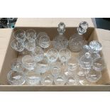 A mixed lot of cut glassware, to include three decanters, whiskey tumblers, wine glasses, etc