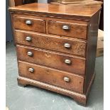 An 18th century and later oak chest of two short over three long drawers on bracket feet,
