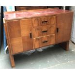 An Art Deco Heal's sideboard, comprising three drawers flanked by cupboard doors, the top drawer