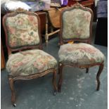A pair of 19th century French occasional chairs, with carved gilt rail, upholstered back and