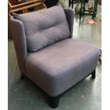 A contemporary low chair, with stylised wingback, 70cmW