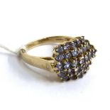 A 9ct gold cluster ring set with pale purple stones, 4.9g