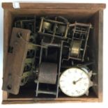 A small box of clock parts for spares and repairs