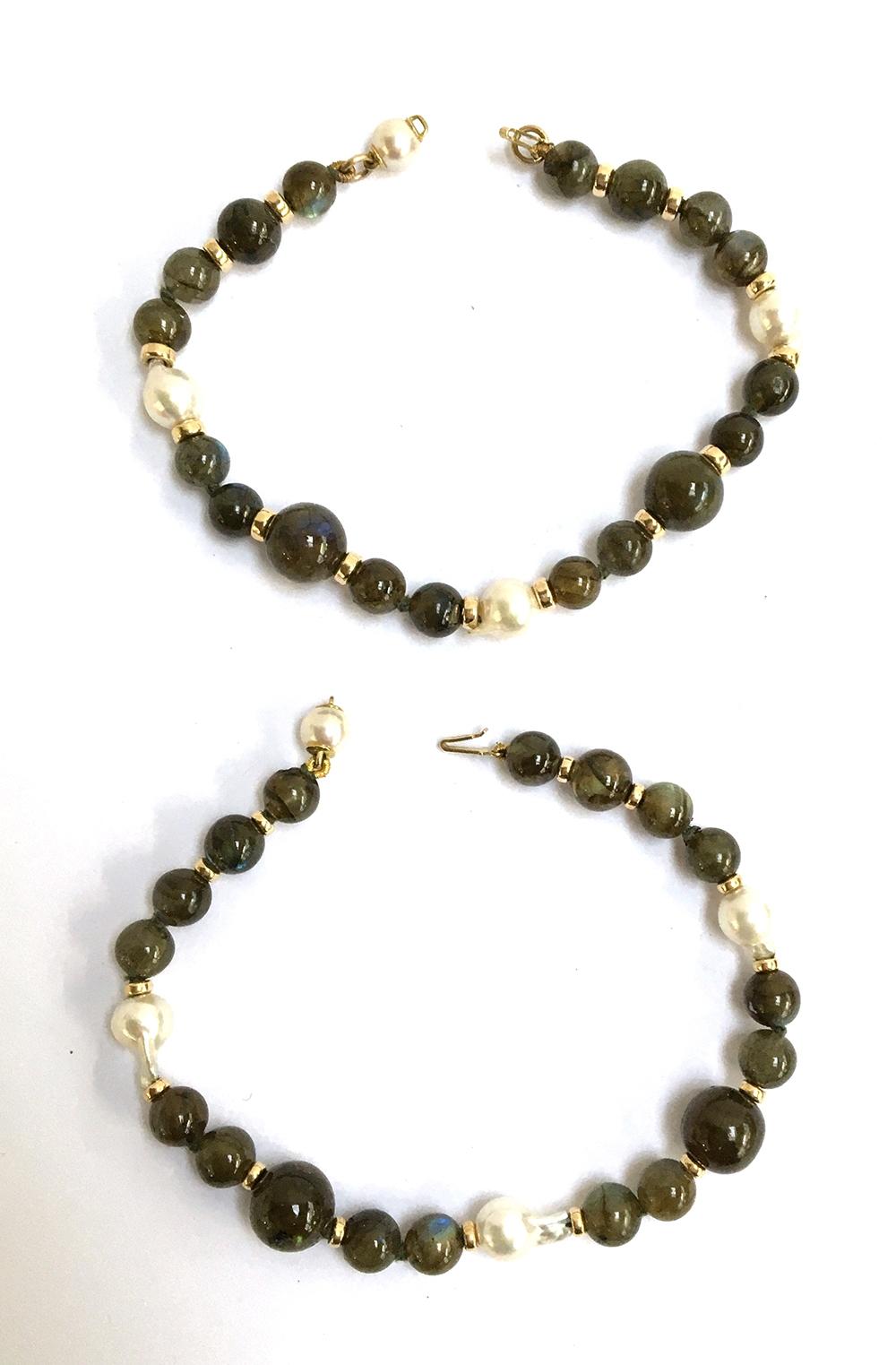 Two bracelets with 18ct gold clasps set with pearls and green stones, maker J KA (possibly J Koehle)