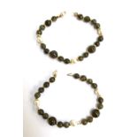 Two bracelets with 18ct gold clasps set with pearls and green stones, maker J KA (possibly J Koehle)