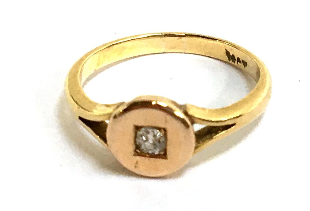 A pretty 18ct ring (hallmarked rubbed but tested)set with small diamond, gross weight 2.8g, size L