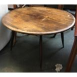An Ercol style circular coffee table, 74cmD