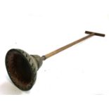 A copper laundry plunger