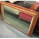 An over mantel mirror with parquetry decoration, 52x87cm