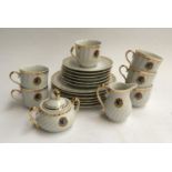 A small part tea set, 'Royal China Bangladesh', heightened in gilt; together with a Monno part tea