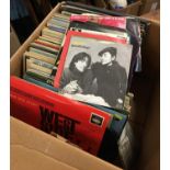 Two boxes of vinyl LPs, mainly musicals, and a number of 7" vinyl singles, to include 'The Moody
