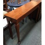 A narrow oak sideboard, on heavy club legs, 105x30.5x74cmH