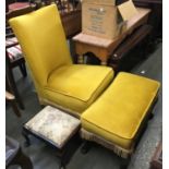 A yellow upholstered bedroom chair with matching footstool and one other