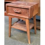 A G-Plan bedside table, single drawer on splayed legs with undershelf, drawers stamped 'E. Gomme',