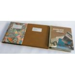 Three postcard albums containing mostly British and foreign postcards