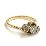 A 9ct three diamond crossover ring, 3.2g