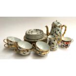 A Japanese tea set, 19 pieces, decorated with gilt crane pattern