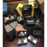 A mixed lot of photographic equipment to include Kodak EK300, two Polaroid 104 land cameras, Kodak