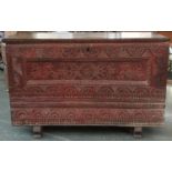 A Sardinian carved chest, the originally hinged top now fixed with cupboard doors at either end, the