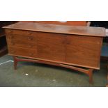 A mid-century sideboard with four drawers and two cupboard doors, bearing ivorine plaque '