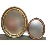 An oval giltwood mirror, 65cmH, together with one other smaller