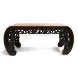 A Chinese hardwood stool with carved decoration, 76cmW