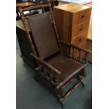An American rocking chair, turned supports and stretchers, leather upholstered back and seat