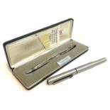 A stainless steel Parker 25 fountain pen; together with a silver plated Cross ballpoint pen