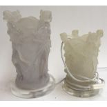 Two frosted resin table lamps in the style of Lalique, in the form of four outward looking