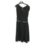 A vintage black dress, approx. size 10; together with a vintage dress with scarf and long evening