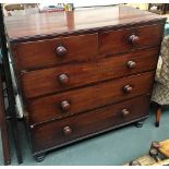 A 19th century mahogany chest of two short over three long drawers, turned wooden knobs, measuring