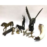 A mixed lot of metal and wood animal figurines, to include lion, owl, antelope, eagle, brass horse