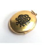 A Victorian yellow metal (tests as 9ct) and black enamel mourning pendant locket. Gross weight 21.6g