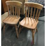 A pair of 20th century pine kitchen chairs