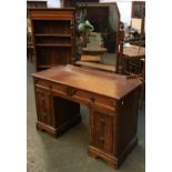 An oak kneehole dressing table, adjustable mirror with two drawers, the kneehole flanked by four