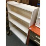 A small white painted bookshelf of four shelves, 76.5cmW