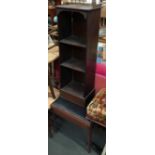 A narrow shelf of three shelves, pierced metal gallery, 30x88cmH; together with a piano stool